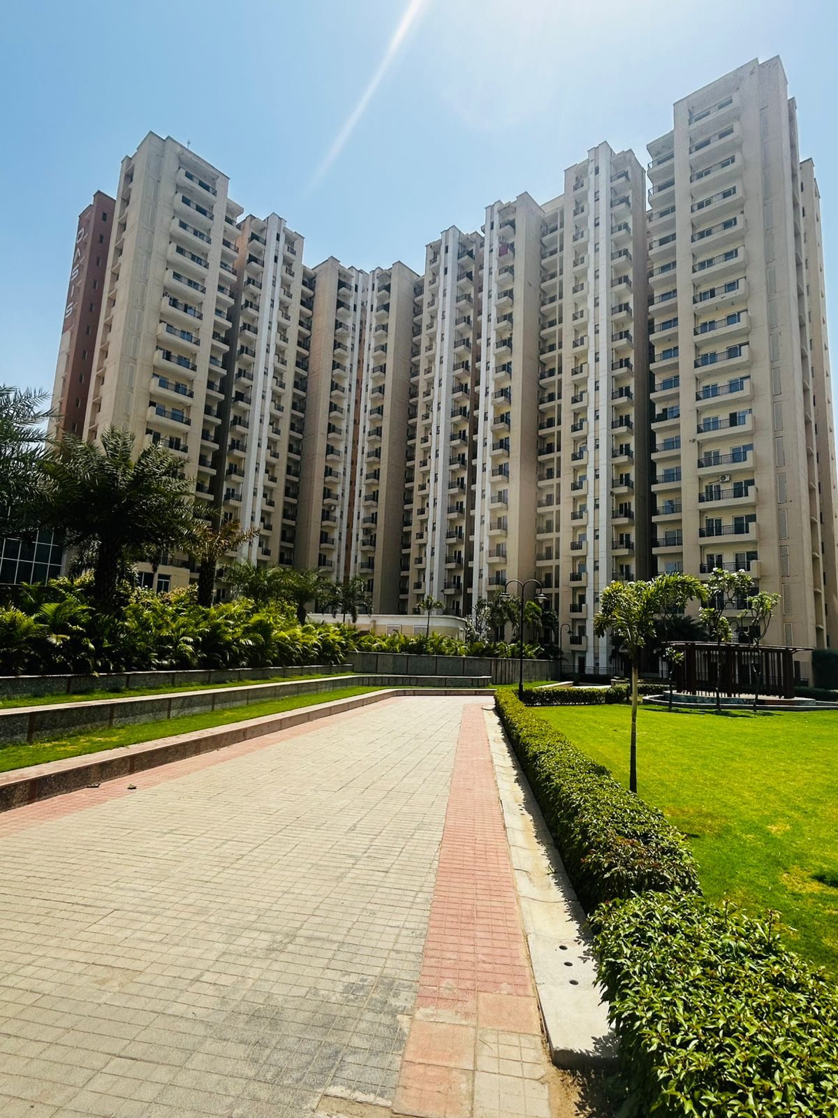 Paved pathway leading up to an Oasis Grandstand tower