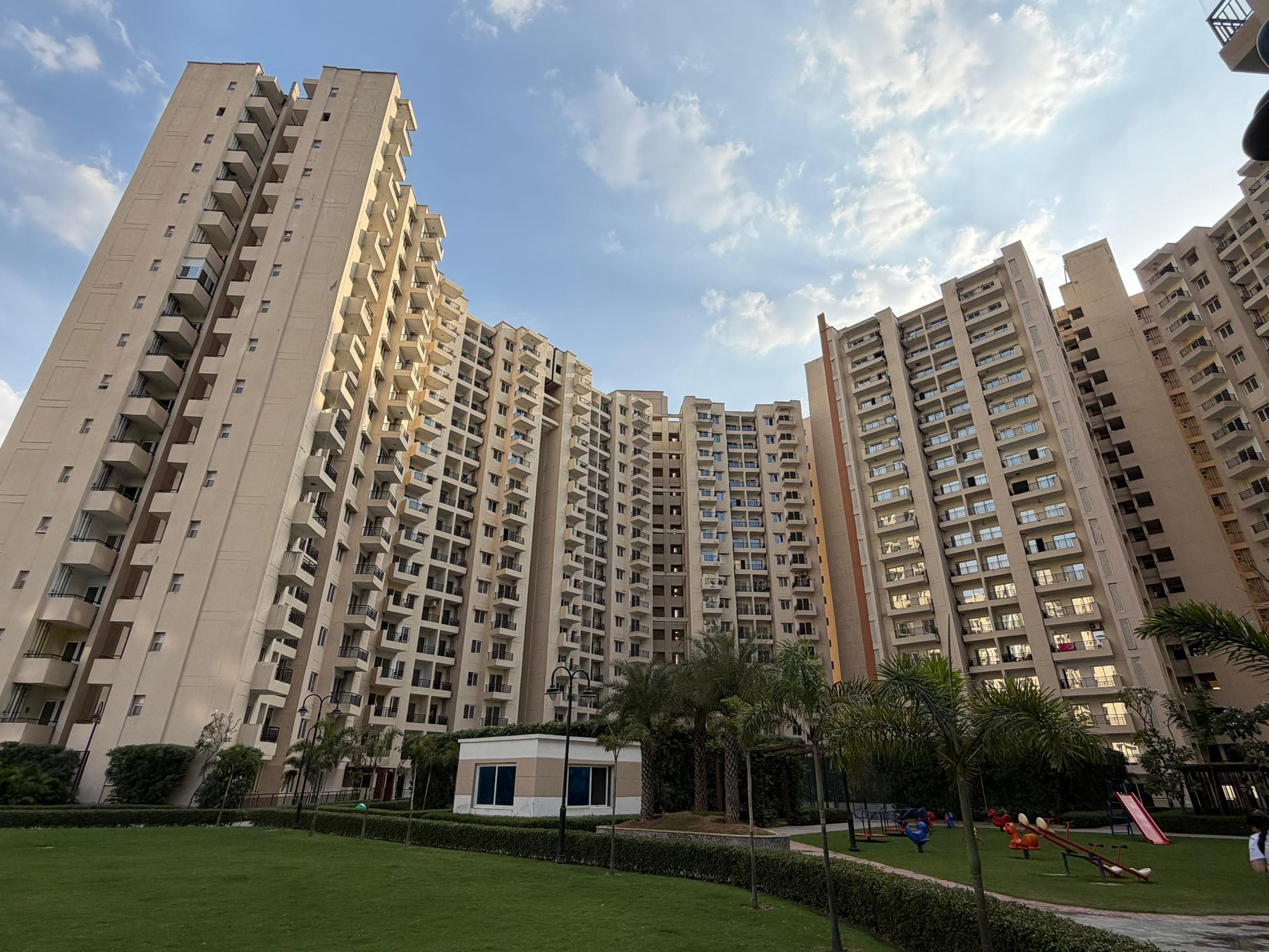 Oasis Grandstand tower with lawn and playground area